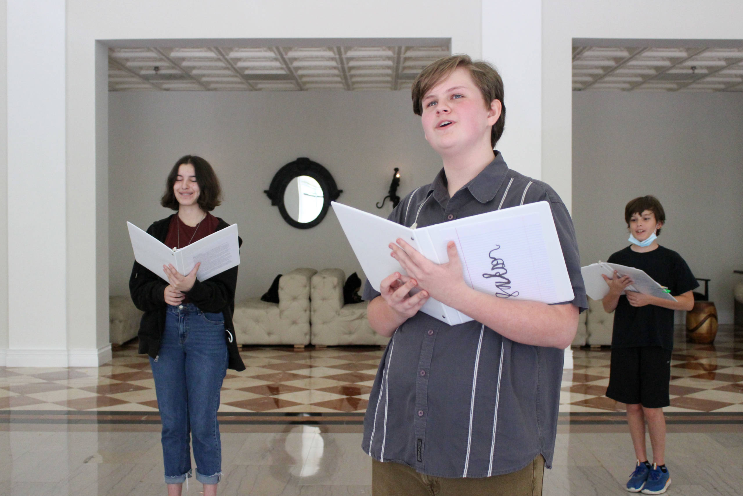 Three kids singing in their music lessons in Tampa
